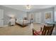 Large bedroom featuring a sitting area, ceiling fan, and neutral color scheme at 351 Allendale Dr, Canton, GA 30115