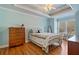 Cozy bedroom with blue walls, ceiling fan, and beautiful hardwood floors at 351 Allendale Dr, Canton, GA 30115