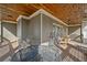 Comfortable covered patio with seating arrangement, perfect for relaxing and enjoying serene outdoor views at 351 Allendale Dr, Canton, GA 30115