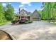 Charming craftsman home with a circular driveway and lush landscaping at 351 Allendale Dr, Canton, GA 30115
