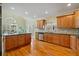 Spacious kitchen featuring custom cabinets, stainless appliances, and hardwood floors at 351 Allendale Dr, Canton, GA 30115
