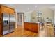Gourmet kitchen with island, breakfast nook, and stainless steel refrigerator at 351 Allendale Dr, Canton, GA 30115