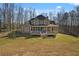 The back of this beautiful home features a spacious deck and lush backyard at 351 Allendale Dr, Canton, GA 30115