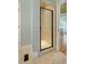 Shower with light tile and a glass shower door at 351 Allendale Dr, Canton, GA 30115