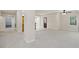 Unfinished basement with neutral carpet, ceiling fan and an access door to the exterior at 4125 Gables Pl, Buford, GA 30519