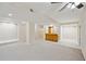 Finished basement with a bar area, neutral carpet, and tile, for potential living space at 4125 Gables Pl, Buford, GA 30519