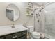 Stylish bathroom featuring modern fixtures, a marble-tiled shower, and a sleek dark vanity at 4125 Gables Pl, Buford, GA 30519