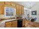 Bright eat-in kitchen featuring granite countertops, stainless steel appliances, and hardwood floors at 4125 Gables Pl, Buford, GA 30519