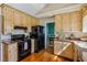 Modern kitchen with stainless steel appliances, wooden cabinets, granite countertops, and a breakfast nook at 4125 Gables Pl, Buford, GA 30519