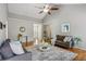 Spacious living room featuring hardwood floors, vaulted ceilings, neutral paint, and lots of light at 4125 Gables Pl, Buford, GA 30519