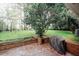 Expansive backyard featuring a patio and lush greenery, perfect for outdoor entertaining at 4144 Hideaway Dr, Tucker, GA 30084
