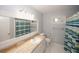 Well-lit bathroom with modern fixtures, vanity, and a stylish shower curtain at 4144 Hideaway Dr, Tucker, GA 30084