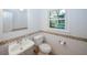 Bathroom with white subway tile, new sink, toilet, and a decorative border at 4144 Hideaway Dr, Tucker, GA 30084