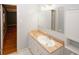 A newly renovated bathroom with modern vanity, bright mirror, and new fixtures at 4144 Hideaway Dr, Tucker, GA 30084