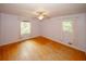 Serene bedroom featuring wood floors and natural light at 4144 Hideaway Dr, Tucker, GA 30084