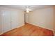 Bedroom with hardwood floors, double closets, and neutral color scheme offers a cozy atmosphere at 4144 Hideaway Dr, Tucker, GA 30084
