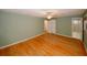 This spacious bedroom includes hardwood flooring, closet space, and an ensuite bathroom at 4144 Hideaway Dr, Tucker, GA 30084