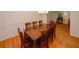 Elegant dining room featuring hardwood floors, a large table, and ample seating at 4144 Hideaway Dr, Tucker, GA 30084