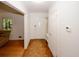 Inviting entryway featuring hardwood floors, a coat closet, and natural light from a nearby window at 4144 Hideaway Dr, Tucker, GA 30084