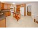 Open kitchen design with granite countertops, tile floors, and modern appliances at 4144 Hideaway Dr, Tucker, GA 30084