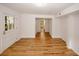 Living room features wood floors, natural light, and access to other rooms at 4144 Hideaway Dr, Tucker, GA 30084