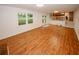 Spacious living room featuring wood floors, with a view to the kitchen and backyard at 4144 Hideaway Dr, Tucker, GA 30084
