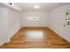 Living room featuring wood floors, natural light, and door to the backyard at 4144 Hideaway Dr, Tucker, GA 30084