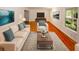 Bright and inviting living room with hardwood floors, a plush sofa, and elegant decor at 4144 Hideaway Dr, Tucker, GA 30084