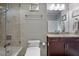 Bathroom featuring granite countertop vanity with a tile shower and tub at 855 Peachtree Ne St # 2801, Atlanta, GA 30308