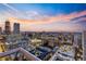 Stunning skyline view from a high-rise building featuring city lights and a colorful sunset at 855 Peachtree Ne St # 2801, Atlanta, GA 30308