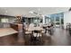 Well-appointed common area with modern tables, seating, and a convenient kitchenette for gatherings at 855 Peachtree Ne St # 2801, Atlanta, GA 30308