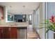 Kitchen area with stainless appliances, granite countertops and city views through floor to ceiling windows at 855 Peachtree Ne St # 2801, Atlanta, GA 30308