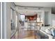 Open living room with hardwood floors, modern kitchen, and large windows with city views at 855 Peachtree Ne St # 2801, Atlanta, GA 30308