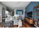 Elegant living room with hardwood floors, modern shelving, and comfortable seating at 855 Peachtree Ne St # 2801, Atlanta, GA 30308