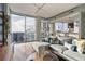 Bright, open living room with floor-to-ceiling windows, hardwood floors, and modern furnishings at 855 Peachtree Ne St # 2801, Atlanta, GA 30308
