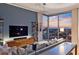 Beautiful living room featuring floor-to-ceiling windows, city views, and stylish furniture at 855 Peachtree Ne St # 2801, Atlanta, GA 30308