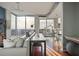 Cozy living room with city views, hardwood floors, and modern decor at 855 Peachtree Ne St # 2801, Atlanta, GA 30308