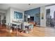 Modern living room with large windows, an entertainment center, and city views at 855 Peachtree Ne St # 2801, Atlanta, GA 30308