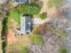 Aerial view of a gray two-story home with a large backyard and wooden deck at 113 Emerald Pines Dr, Dallas, GA 30157