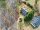 Aerial view of a gray two-story home with a large backyard and deck at 113 Emerald Pines Dr, Dallas, GA 30157