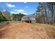 Spacious backyard featuring a deck, perfect for outdoor living and enjoying the serene surroundings at 113 Emerald Pines Dr, Dallas, GA 30157