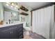 Bathroom with modern vanity and shelving, along with a shower and tub combination at 113 Emerald Pines Dr, Dallas, GA 30157
