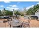 Expansive wooden deck with multiple seating areas and grills, ideal for outdoor entertaining and relaxation at 113 Emerald Pines Dr, Dallas, GA 30157