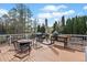 Outdoor deck with comfortable seating and a grill, perfect for enjoying beautiful days outside at 113 Emerald Pines Dr, Dallas, GA 30157