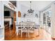 Dining room featuring hardwood floors, a 'Gather' sign, and sliding doors to the outside at 113 Emerald Pines Dr, Dallas, GA 30157