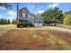 Beautiful two-story home with a manicured front lawn, classic architecture, and inviting entrance at 113 Emerald Pines Dr, Dallas, GA 30157