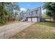 Charming two-story home with a two-car garage, well-maintained lawn, and inviting curb appeal at 113 Emerald Pines Dr, Dallas, GA 30157