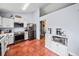 Spacious kitchen featuring stainless steel appliances and eye-catching tile flooring at 113 Emerald Pines Dr, Dallas, GA 30157