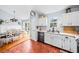 Open kitchen and dining area with stainless steel appliances and sliding door access at 113 Emerald Pines Dr, Dallas, GA 30157