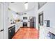 Bright kitchen featuring stainless appliances, white cabinets, and unique tiled floors at 113 Emerald Pines Dr, Dallas, GA 30157